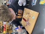 Soldering in Studio by Logan Downs