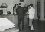 Students at the Circulation Desk in Alumni Memorial Library, 1950s